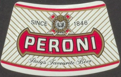 A Peroni beer coaster with the brand name prominently displayed, the text "SINCE 1846" above, and "Italy's Favourite Beer" below, featuring a decorative emblem at the top center.