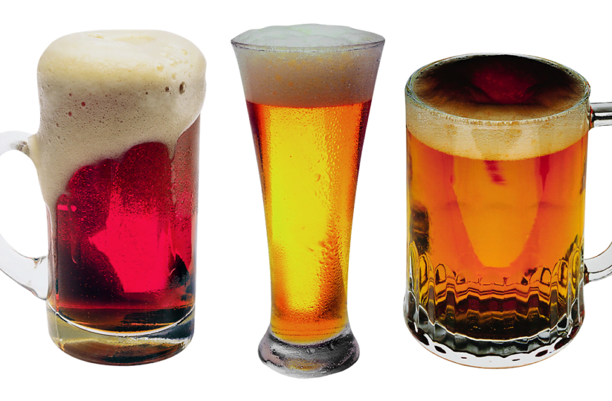 Three different glasses of beer isolated on a white background, showcasing varying colors and head foam densities. From left to right: a dimpled mug with dark beer and a thick head, a tall pilsner glass with light beer and a moderate head, and a handled mug with amber beer and a creamy head.