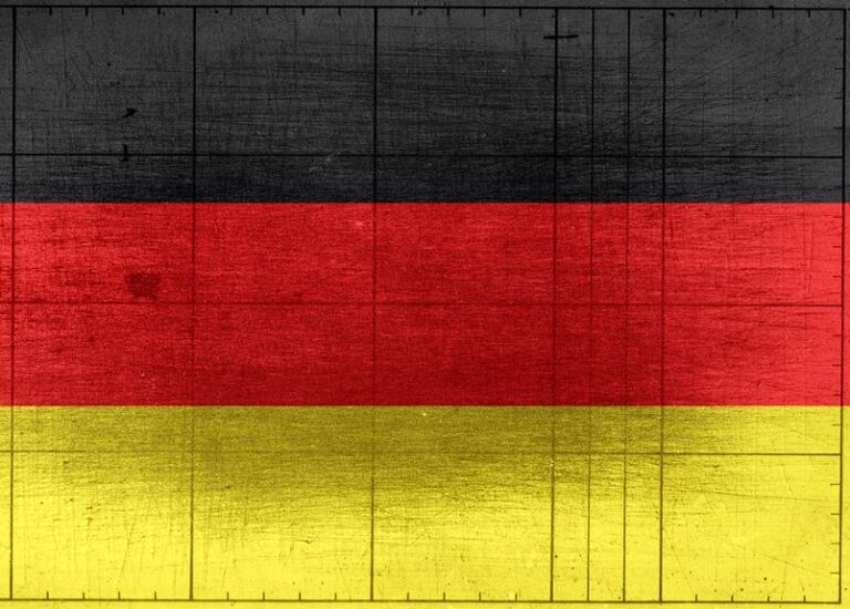 A distressed texture overlay on the flag of Germany, consisting of horizontal stripes in black, red, and yellow.